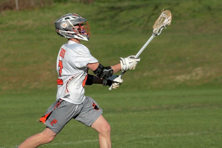 Midfielder Connor Rogers throwing the ball down field.