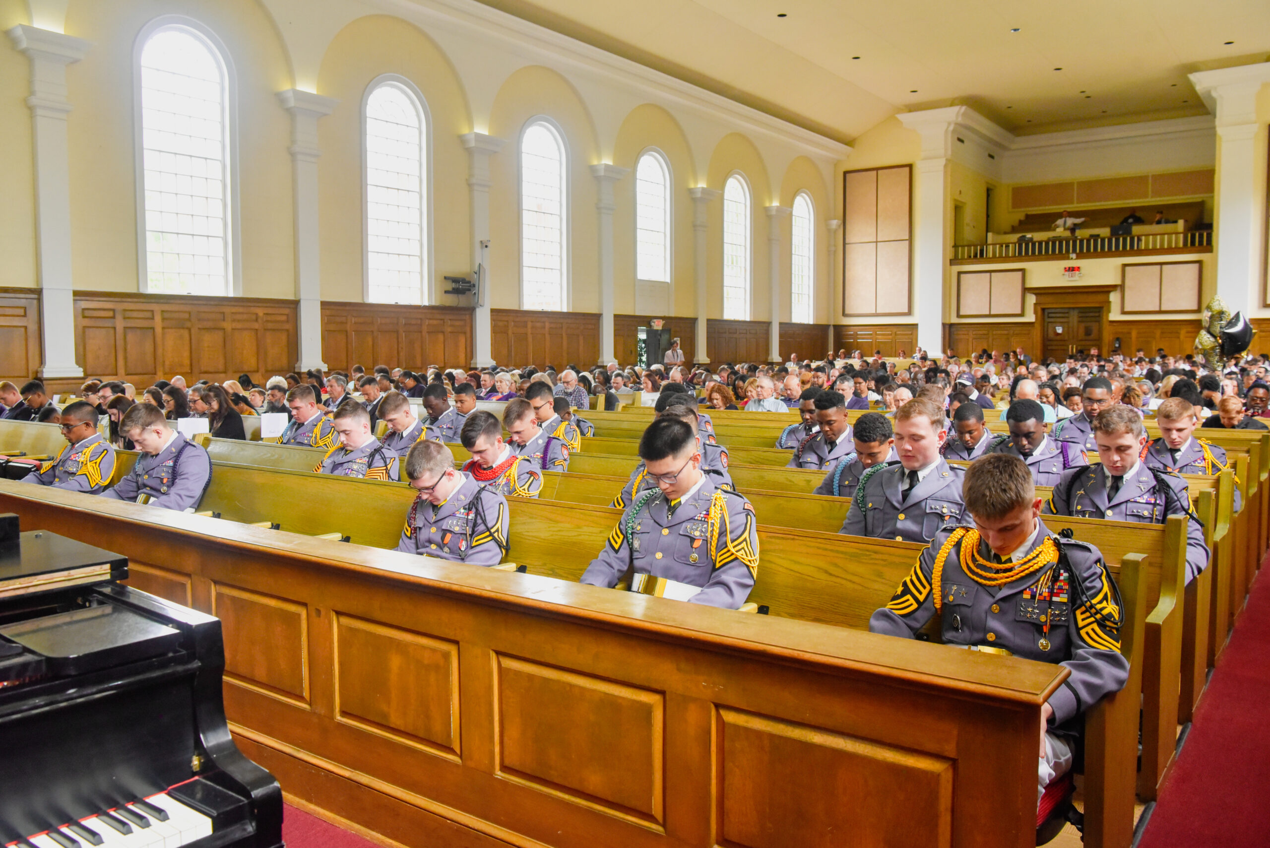 The corps of cadets seated in chapel pews during a service